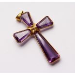 AN 18CT GOLD AND AMETHYST CROSS. 2.25ins long.