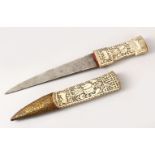 AN EARLY PERSIAN QAJAR HAND CARVED BONE / IVORY DAGGER, with carved decoration of figures and