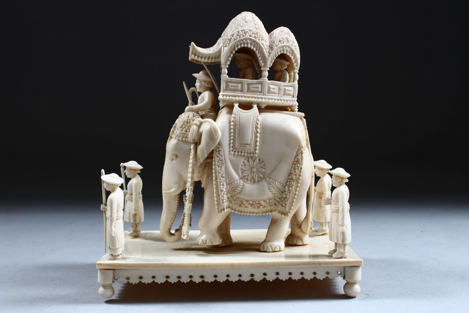 A 19TH CENTURY INDIAN CARVED IVORY FIGURE OF AN ELEPHANT AND ATTENDANTS, in a striding position with - Image 2 of 9