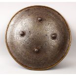 A GOOD EARLY ISLAMIC CALLIGRAPHIC COPPER SHIELD. decorated with panels of calligraphy and figures,