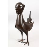 A PERSIAN ISLAMIC BRONZE MYTHICAL BIRD WITH A MALE HEAD, 40cm high, 26cm wide.