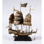 A 19TH CENTURY CHINESE SOLID SILVER MODEL OF A JUNK, the back of the ship with four character