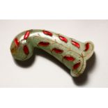 A GOOD EARLY 20TH CENTURY INDIAN MUGHAL CARVED JADE DAGGER KHANJAR HANDLE, With red inlaid stones