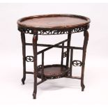 A GOOD 19TH CENTURY CHINESE CARVED HARDWOOD OVAL TABLE, The table carved in bamboo form, with a