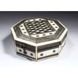 AN ANGLO INDIAN BONE AND INLAID OCTAGONAL SHAPED BOX AND COVER, 13.5cm diameter.