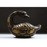 A GOOD EARLY POSSIBLY TANG PERIOD CHINESE SILVER AND GILT MODEL OF A DUCK, in a seated position with