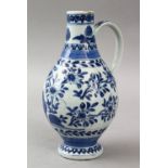 A GOOD JAPANESE 17TH CENTURY BLUE & WHITE ARITA PORCELAIN EWER, the body with formal floral