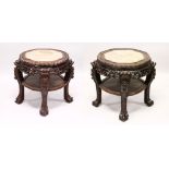 A GOOD PAIR OF 19TH CENTURY CHINESE CARVED HARDWOOD & MARBLE TOP PLANT STANDS, the tops inset with