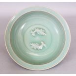 A CHINESE SONG/YUAN STYLE LONGQUAN CELADON DISH, the interior centre moulded with twin fish, 18.