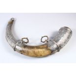 A 19TH CENTURY NORTH AFRICAN POSSIBLY MOROCCAN SILVER AND BRASS OVERLAID POWDER HORN, with chased