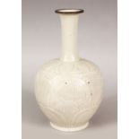 A GOOD CHINESE MONOCHROME DING STYLE CARVED PORCELAIN VASE, the body carved to depict panels of