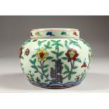 A GOOD CHINESE DOUCAI PORCELAIN JAR AND COVER, the body with floral decoration, the base with a
