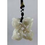 A GOOD 18TH / 19TH CENTURY CHINESE CARVED CELADON JADE PENDANT OF CHILONG, carved to depict four