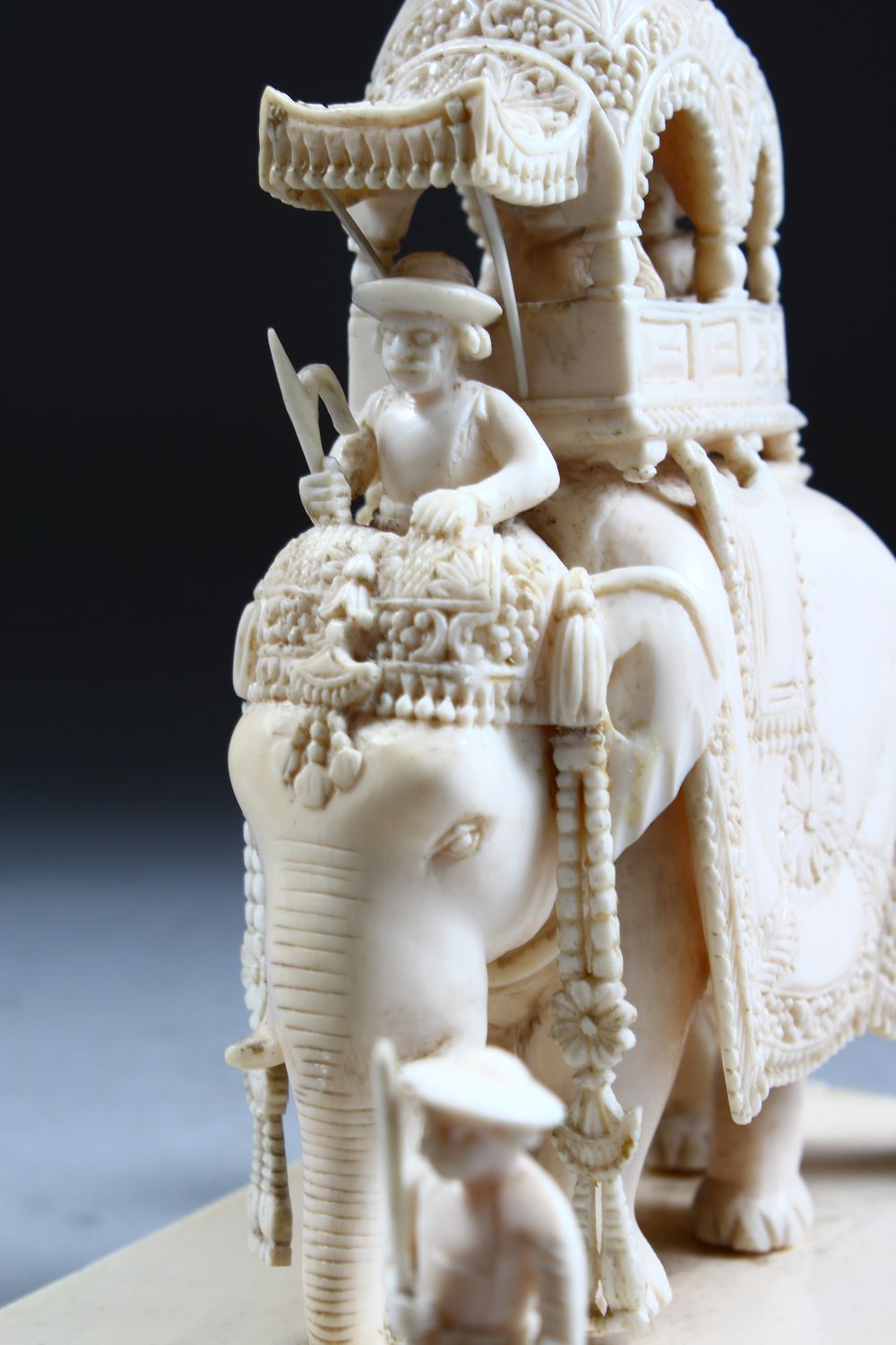 A 19TH CENTURY INDIAN CARVED IVORY FIGURE OF AN ELEPHANT AND ATTENDANTS, in a striding position with - Image 6 of 9