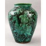 A GOOD PERSIAN QAJAR NATANZ POTTERY VASE, decorated upon a mint green glaze scenes of figures upon