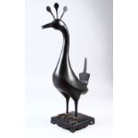 A 19TH CENTURY PERSIAN QAJAR ISLAMIC STEEL BIRD FIGURE, 45cm high x 23cm wide.