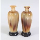 A PAIR OF CHINESE HORN MINIATURE VASES ON STANDS, 10.5cm high.