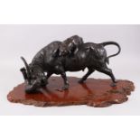 A LARGE AND HEAVY JAPANESE MEIJI PERIOD BRONZE OXEN & TIGER GROUP, the artist has captured in