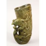 A GOOD CHINESE CARVED JADE / HARDSTONE LIBATION CUP, carved with phoenix head handle, 13cm high.