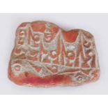 A 20TH CENTURY TIBETAN PRAYER STONE, of irregular form, the red pigmented surface engraved with a