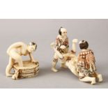 A JAPANESE LATE MEIJI PERIOD CARVED EROTIC IVORY NETUSKE & EROTIC TRIO, the netsuke of a lady over a