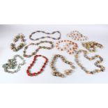 A MIXED LOT OF TEN EASTERN CERAMIC MOSAIC & CRYSTAL / GLASS BEAD NECKLACES, Various styles and