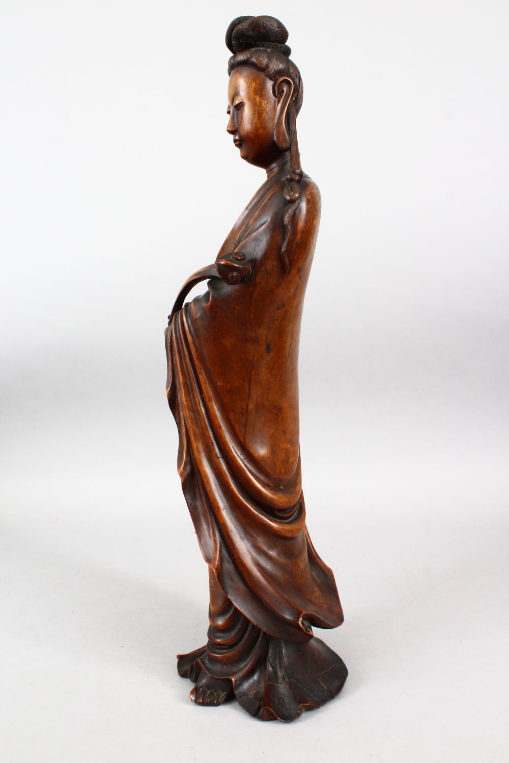 A GOOD 19TH CENTURY CHINESE CARVED HARDWOOD FIGURE OF GUANYIN, stood in traditional attire and - Image 5 of 6