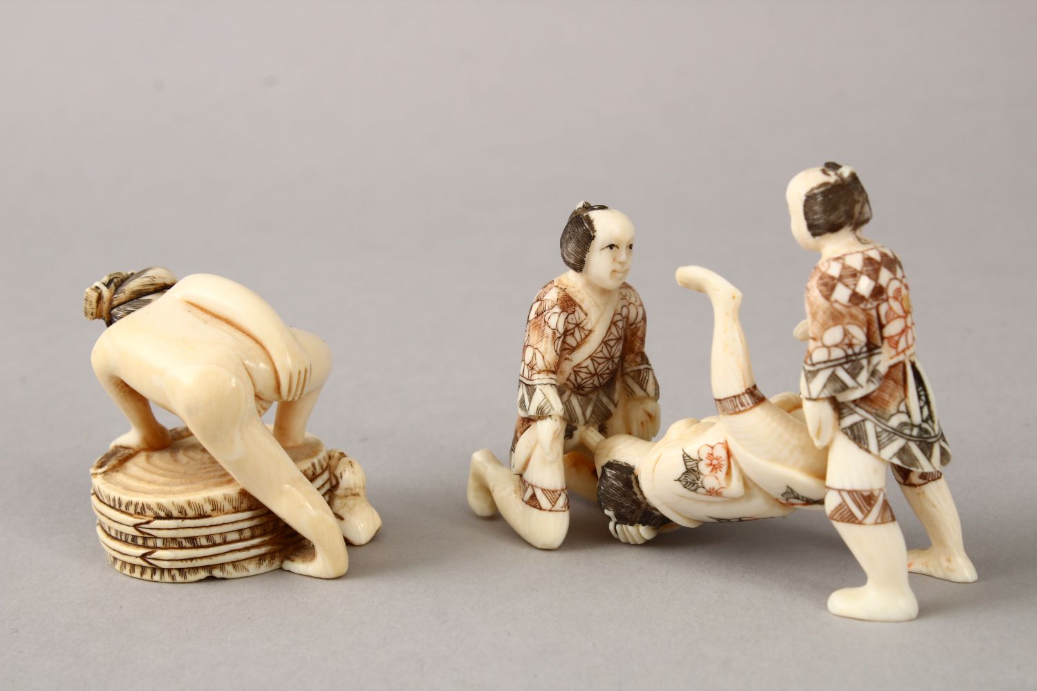 A JAPANESE LATE MEIJI PERIOD CARVED EROTIC IVORY NETUSKE & EROTIC TRIO, the netsuke of a lady over a - Image 2 of 7