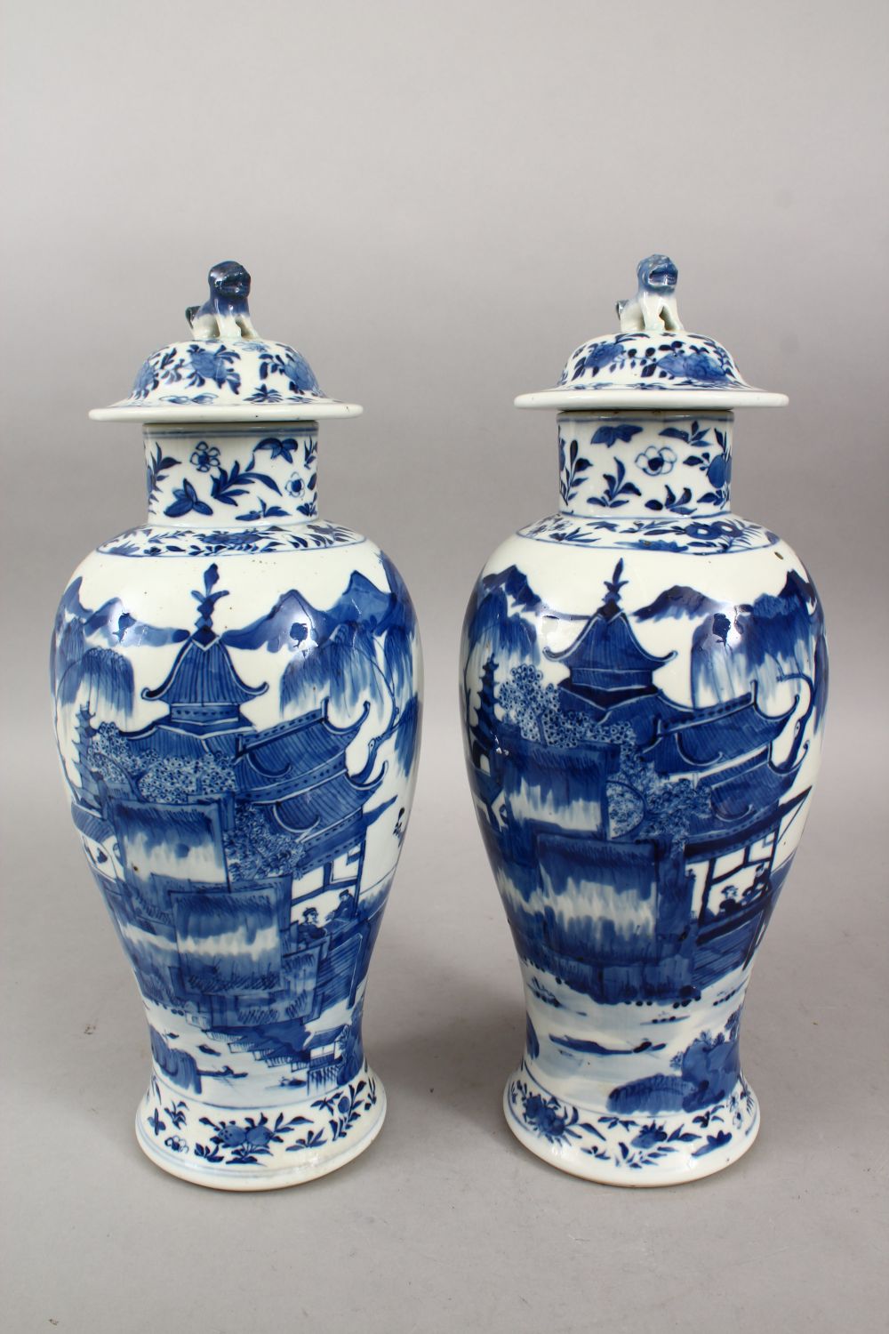 A PAIR OF 19TH CENTURY CHINESE BLUE & WHITE KANGXI STYLE PORCELAIN VASES & COVERS, the body of the - Image 2 of 8