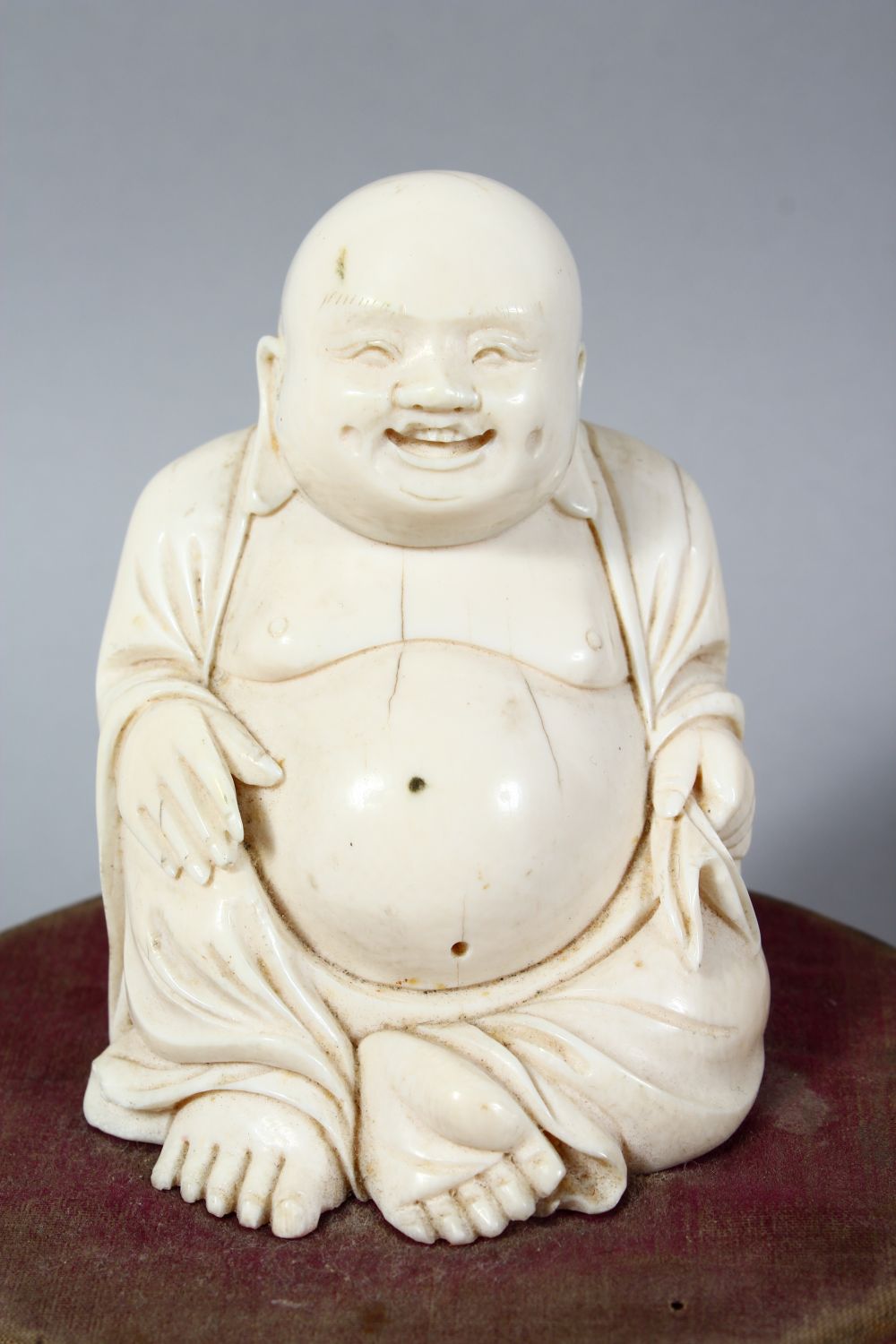 A 19TH CENTURY CHINESE CARVED IVORY BUDDHA ON STAND, the buddha seated upon a later french wooden - Image 2 of 5