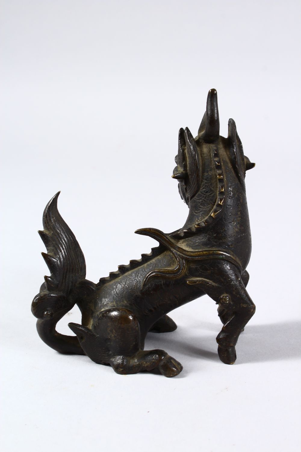 AN 18TH / 19TH CENTURY OR EARLIER CHINESE BRONZE FIGURE OF KYLIN, in a seated position with its - Image 3 of 6