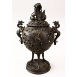 A GOOD 19TH CENTURY CHINESE BRONZE PIERCED LIDDED CENSER, the censer with pierced decoration