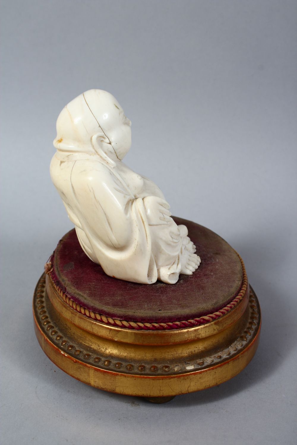 A 19TH CENTURY CHINESE CARVED IVORY BUDDHA ON STAND, the buddha seated upon a later french wooden - Image 3 of 5