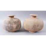 A PAIR OF UNUSUAL EARLY CHINESE BARREL SHAPED TERRACOTTA BURIAL URNS, with broad circular neck and