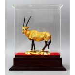 A FINE GILT METAL QATARI PRESENTATION FIGURE OF AN IBEX IN CASE, 33.5cm high x 28cm wide.