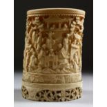 A GOOD CHINESE CANTON CARVED IVORY CYLINDRICAL BRUSH POT, carved in deep relief to depict scenes