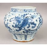 A CHINESE MING STYLE BLUE & WHITE PORCELAIN JAR, the body decorated to depict lion dogs amongst