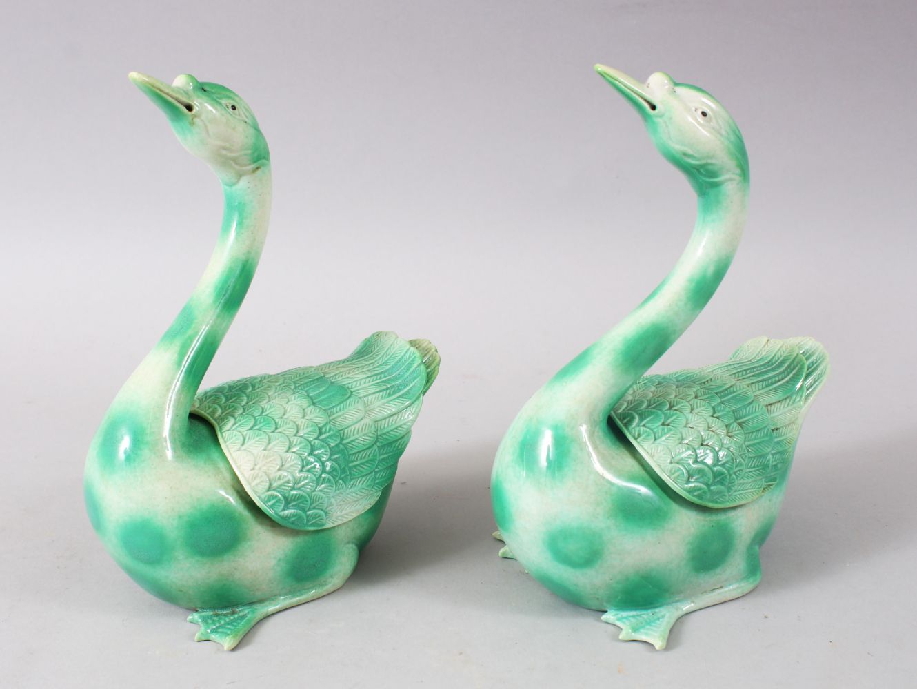 A GOOD PAIR OF CHINESE GREEN GROUND PORCELAIN GEESE / DUCK CENSERS & COVERS, both in original boxes,