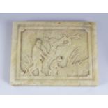 A 20TH CENTURY CHINESE CARVED JADE / SOAPSTONE PLAQUE, depicting two figures in an exterior setting,