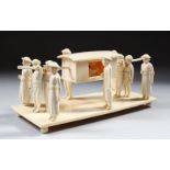 A CARVED IVORY GROUP DEPICTING FIGURES CARRYING A DIGNITARY, 20cm long.