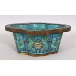 AN EARLY 20TH CENTURY CHINESE CLOISONNE JARDINIERE, of quatrefoil section, the sides decorated