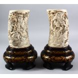 A FINE PAIR OF UNUSUAL JAPANESE MEIJI PERIOD CAVRED IVORY TUSK VASES & LACQUER BASES, the body of