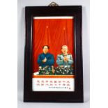 A CHINESE PORCELAIN FRAMED PLAQUE OF MAO ZE DONG AND STALIN, presented in its original fabric