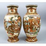 A PAIR OF JAPANESE MEIJI PERIOD SATSUMA VASES, the body of each vase with two large panels depicting