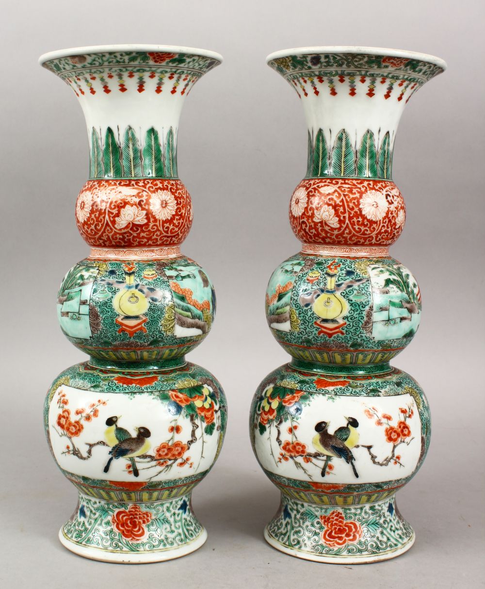 A PAIR OF CHINESE FAMILLE VERTE TRIPLE GOURD PORCELAIN VASES, decorated with panels of lion dogs