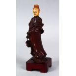 A 19TH CENTURY CHINESE CARVED HARDWOOD & IVORY FIGURE OF GUANYIN, the head formed from carved ivory,