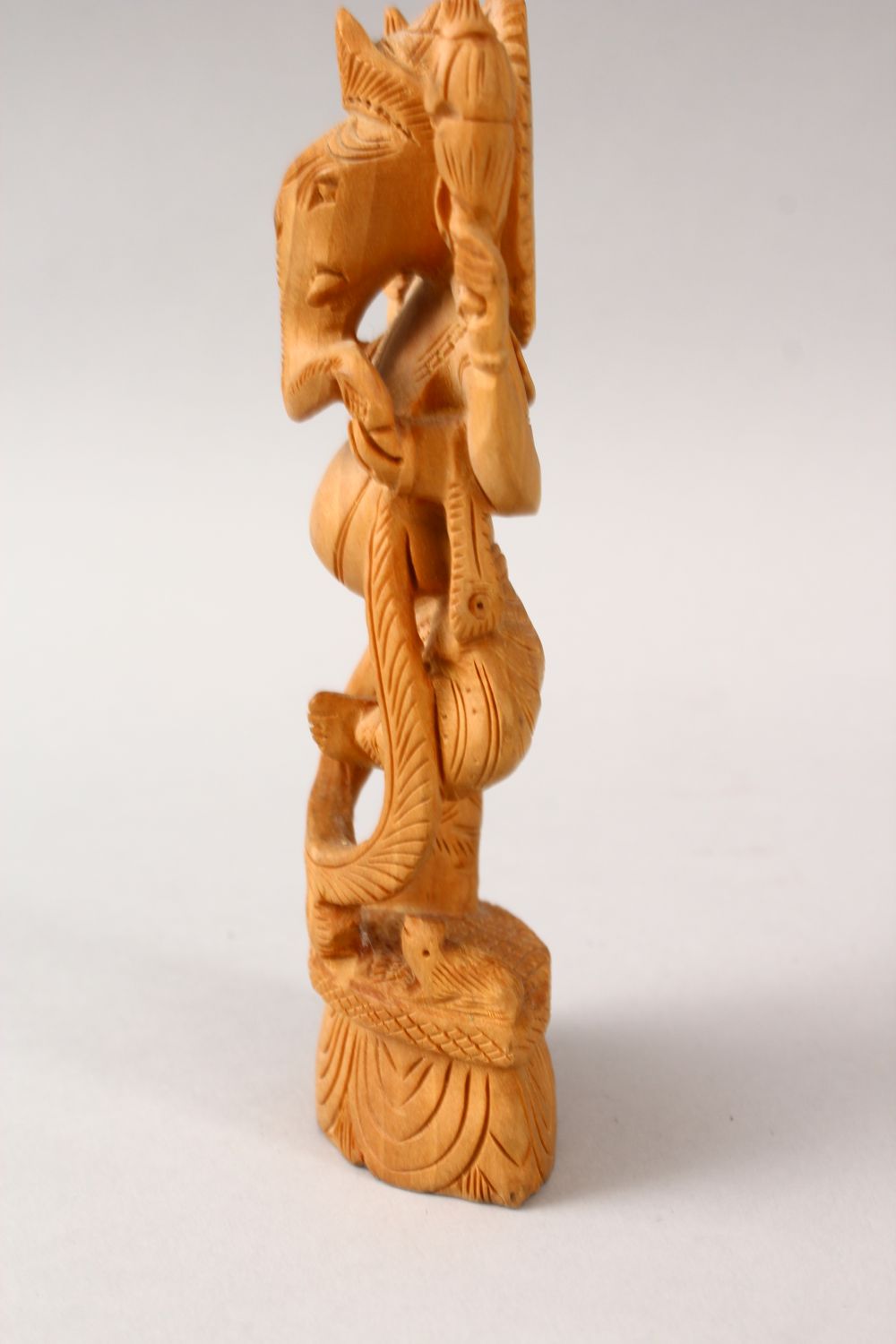 A 20TH CENTURY CARVED WOODEN INDIAN FIGURE OF GANESH, stood upon a carved base, 16cm high - Image 4 of 4