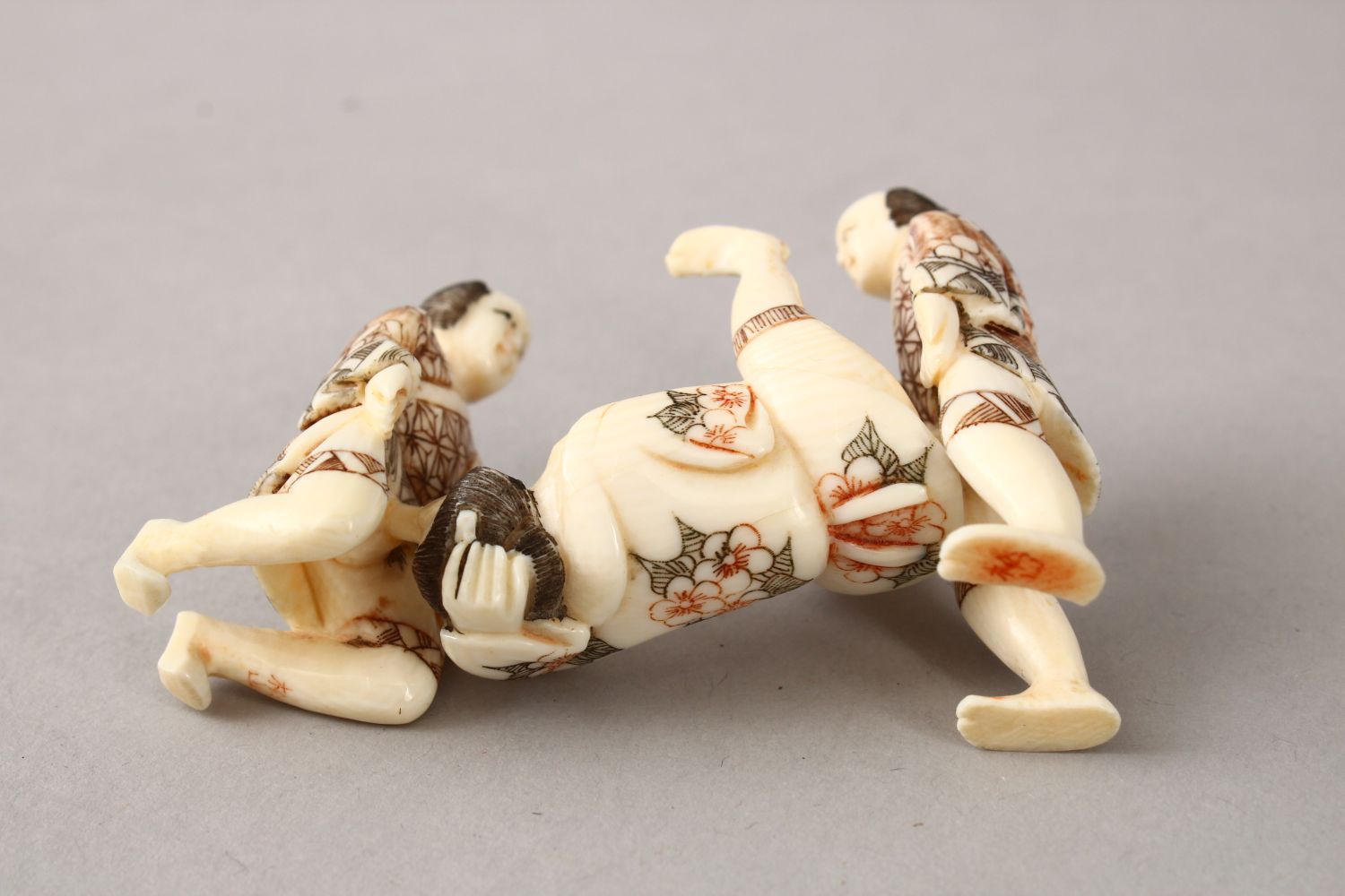 A JAPANESE LATE MEIJI PERIOD CARVED EROTIC IVORY NETUSKE & EROTIC TRIO, the netsuke of a lady over a - Image 4 of 7