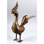 A GOOD PERSIAN GOLD INLAID STEEL MODEL OF A BIRD, 36cm high x 28cm wide.