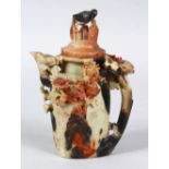 A GOOD QUALITY CHINESE CARVED SOAPSTONE TEA POT, the pot with raised carved decoration of foliage